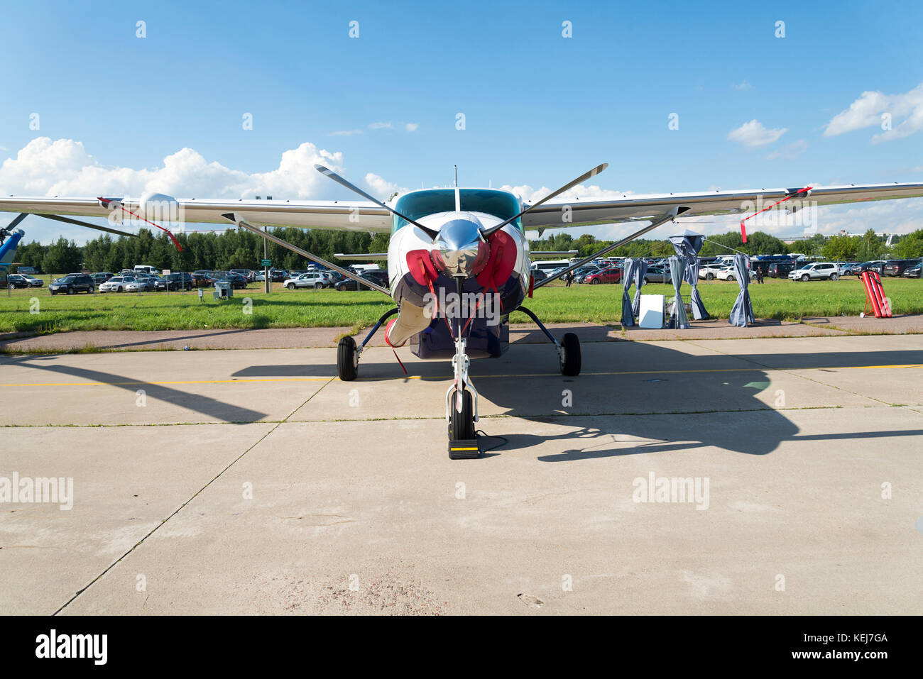 Propeller plane parked on the airfield - front close up view against ...