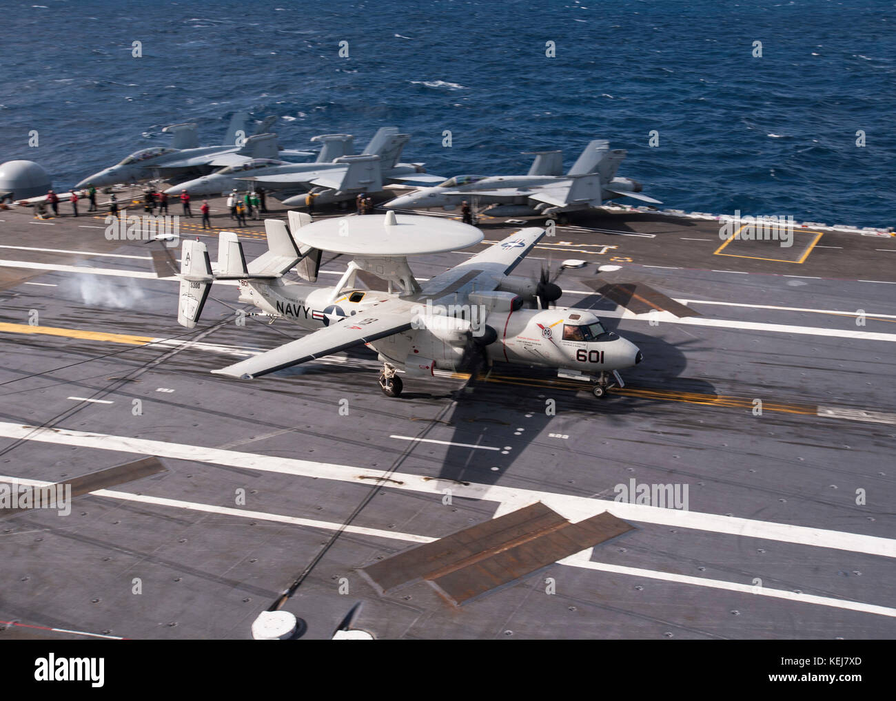 An E2-C Hawkeye attached to Carrier Airborne Early Warning Squadron (VAW) 124 lands on the aircraft carrier Stock Photo