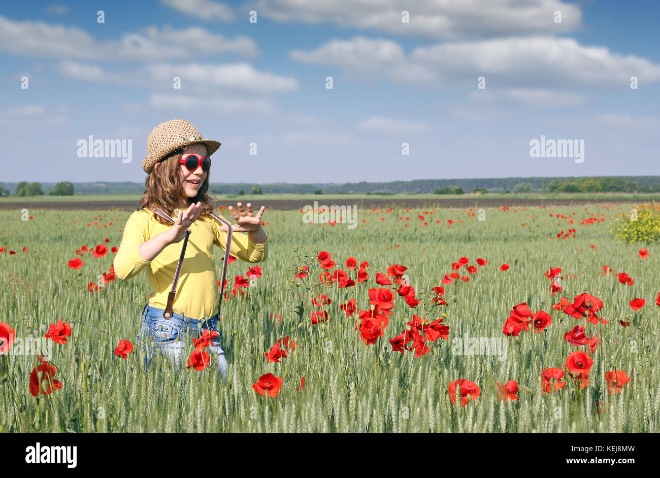 happy little girl in a meadow spring season Stock Photo - Alamy