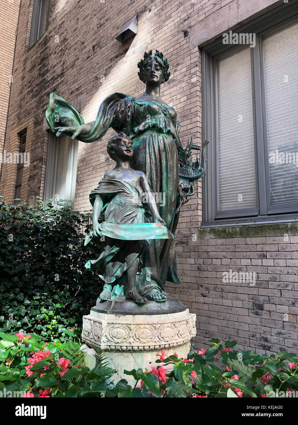 A statue of  Polyhymnia, the Greek goddess of poetry, by Giuseppe Moratti is outside the Liederkranz of the City of New York on the Upper East Side. Stock Photo