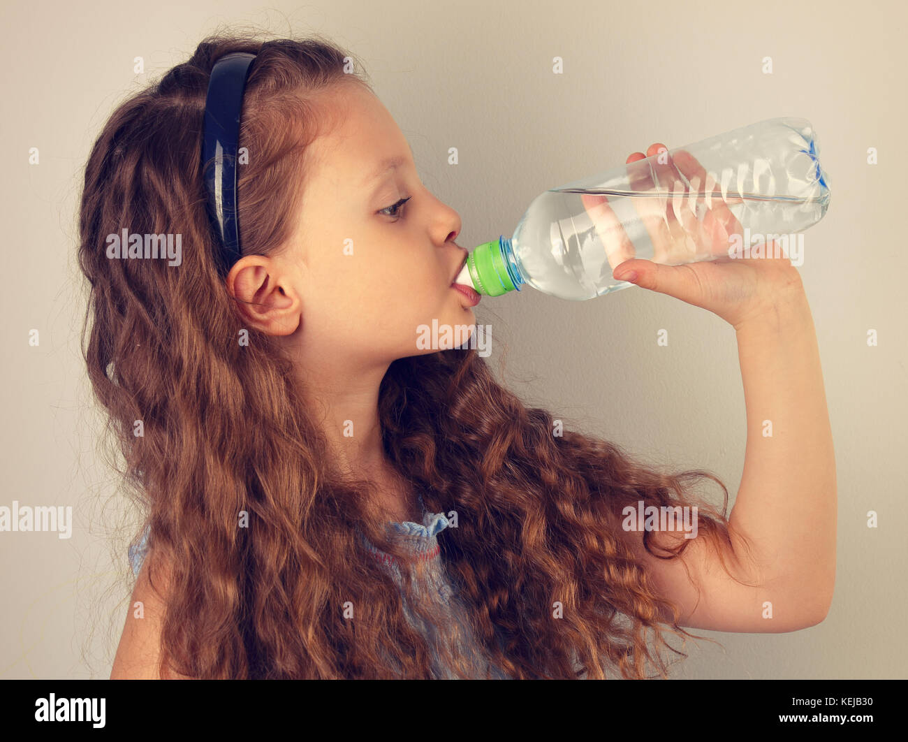 Profile Of Beautiful Long Curly Hair Style Smiling Kid Girl Drinking Water From The Bottle Toned Vintage Portrait Stock Photo Alamy Profile Of Beautiful Long Curly Hair Style Smiling Kid Girl Drinking Water From The Bottle Toned Vintage Portrait Stock Photo Alamy