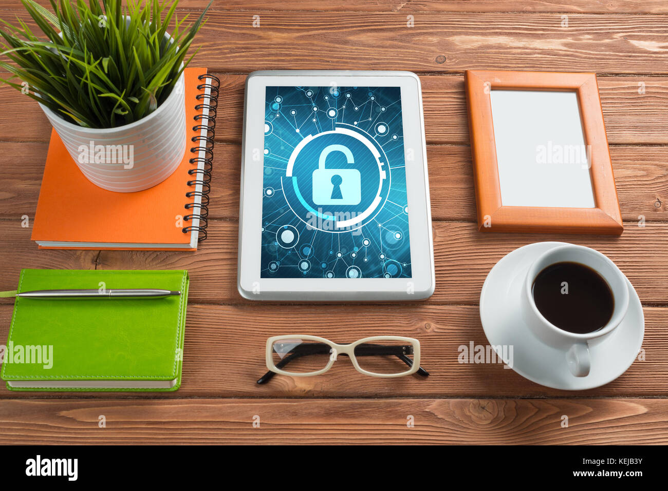 Web security and technology concept with tablet pc on wooden table ...