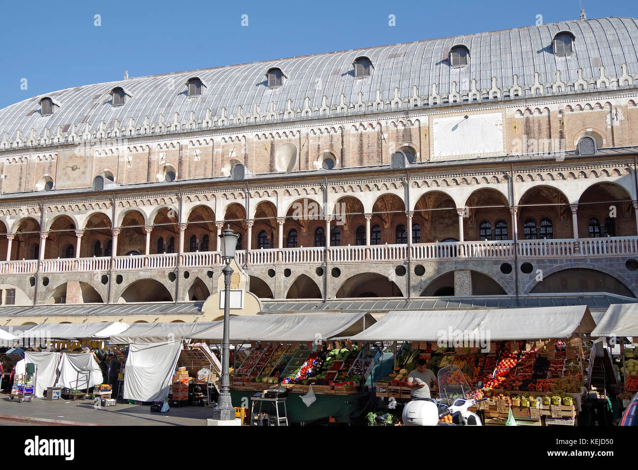 Palazzo della Ragione, medieval seat of government & commerce,  flower market on one side, & herb market on the other, Stock Photo