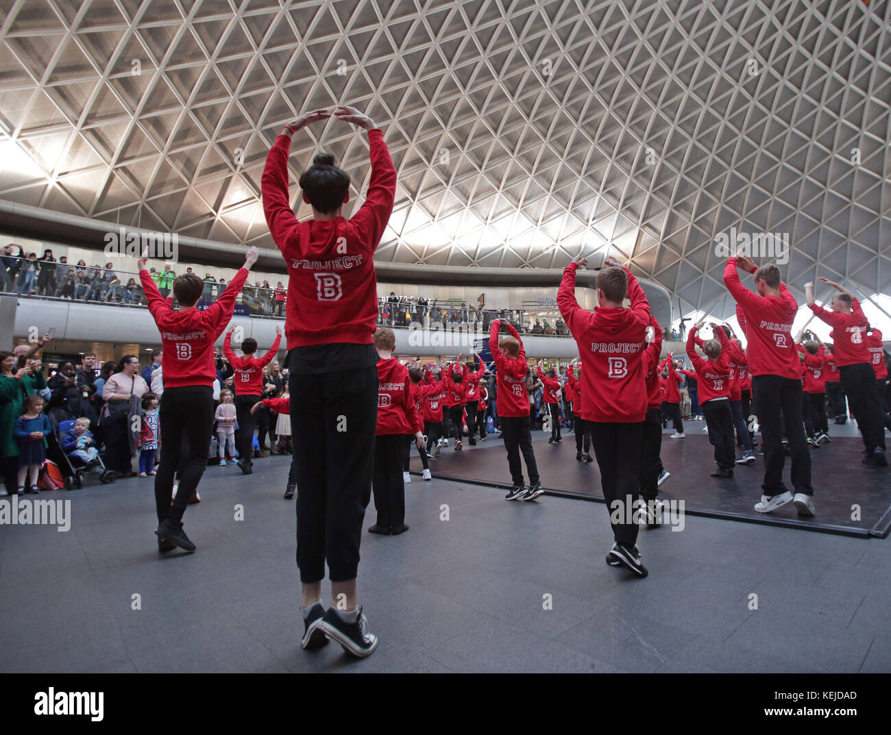 Amateur and professional male performers aged 6-12 taking part in a flash mob organised as part of the the Royal Academy of Dance Project B campaign to encourage more boys to try ballet, at King's Cross Station, London. Stock Photo