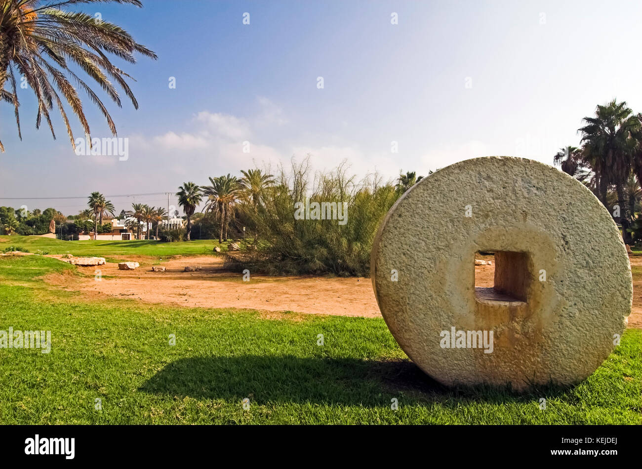 Israel, Herzliya city park, with ancient grindstones on display Stock Photo