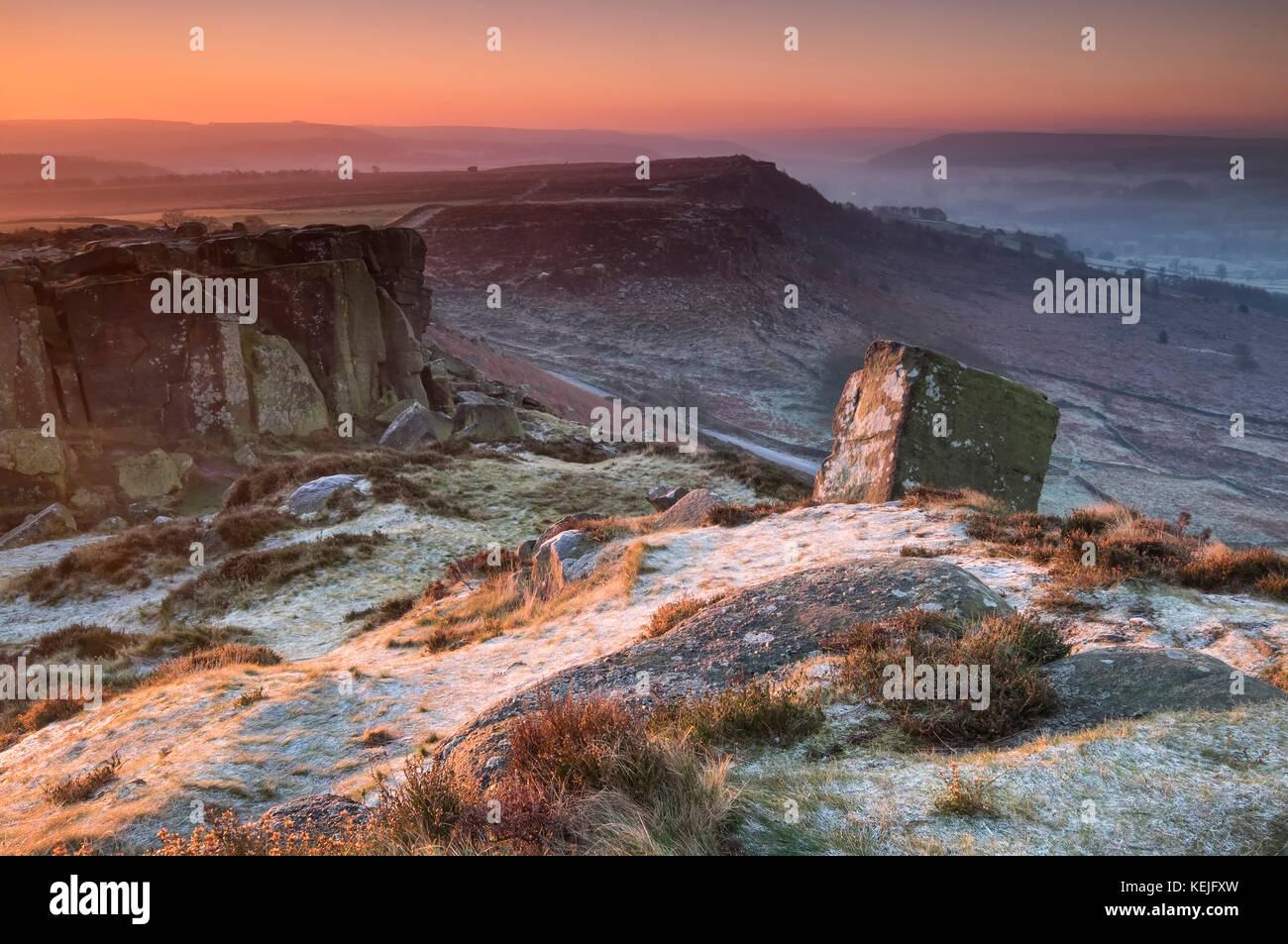 First Light on frost covered Curbar Edge in winter, near Calver, Peak District National Park, Derbyshire, England, UK Stock Photo