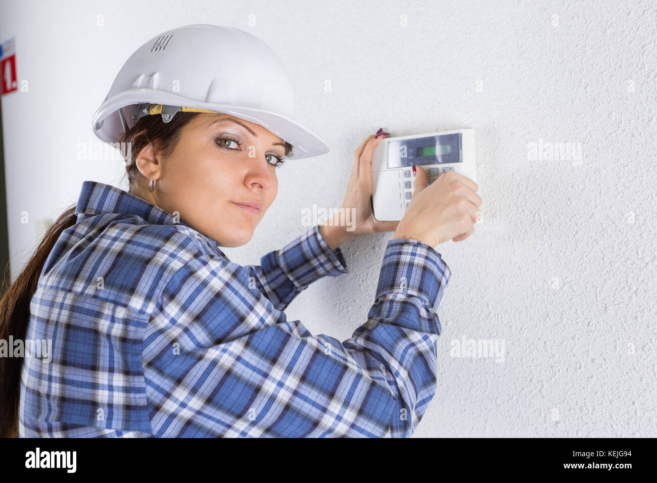 technician installing security system door sensor Stock Photo Alamy