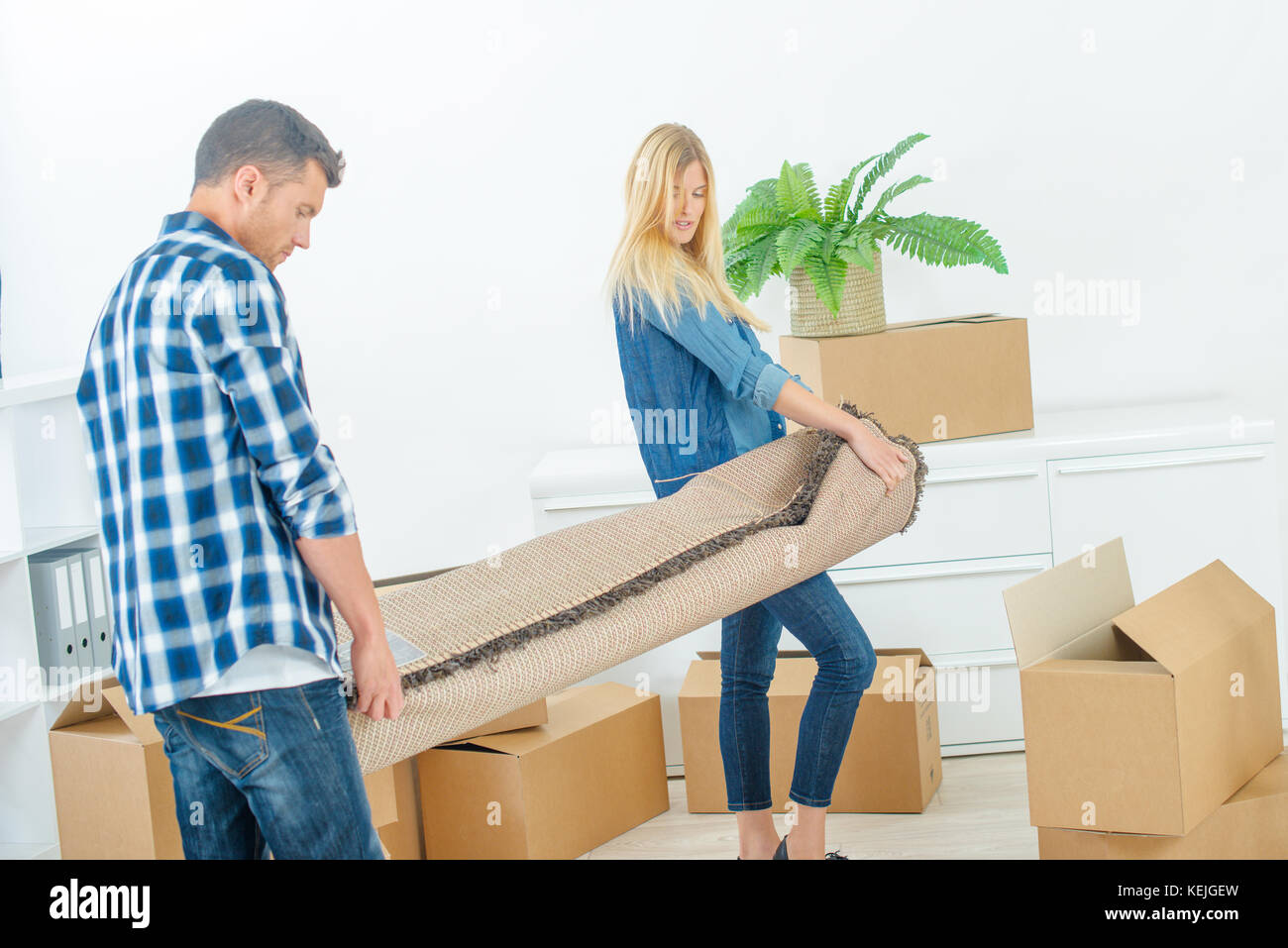 Couple moving into their new home Stock Photo - Alamy