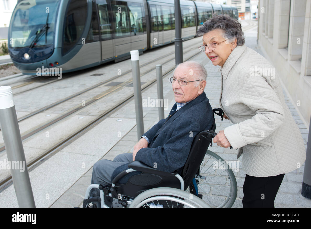 man with disease on a wheelchair and his lovely woman Stock Photo Alamy