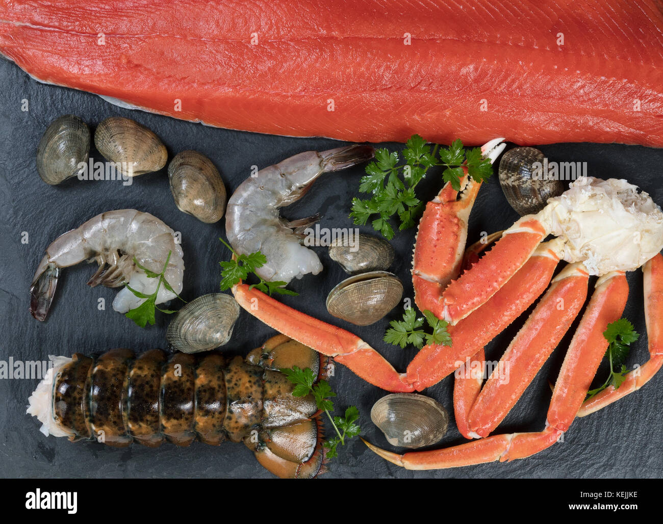 Fresh Seafood on natural slate rock Stock Photo Alamy