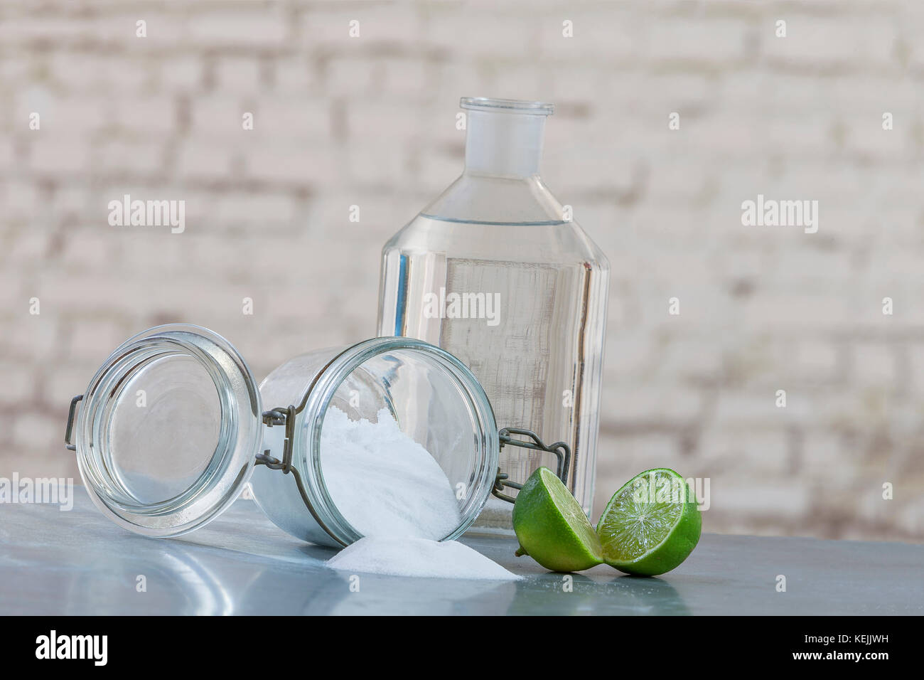 Natural cleaning products, including sodium bicarbonate, invert jar, baking soda, lemon, vinegar