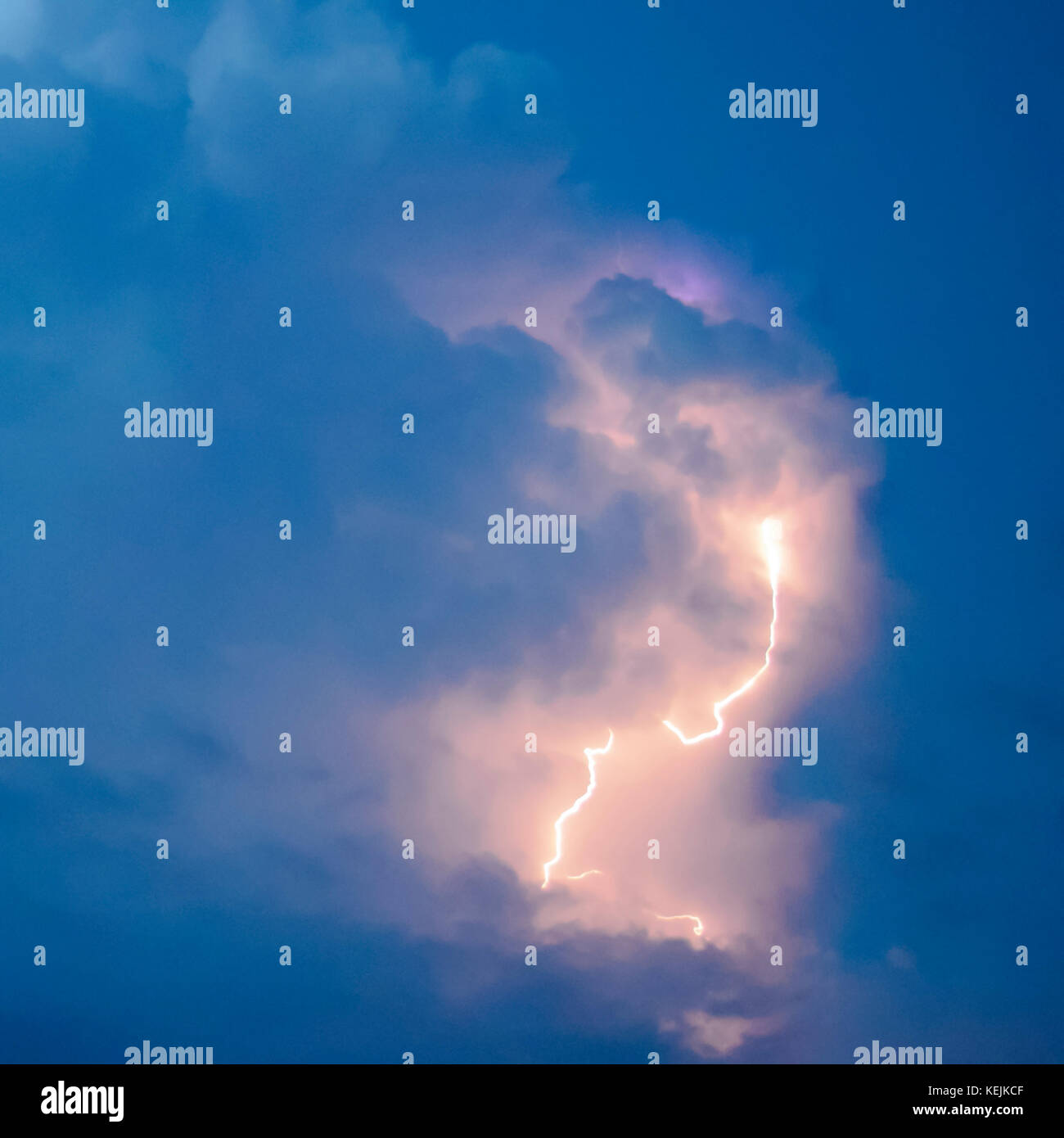 Lightnings in storm clouds. Peals of a thunder and the sparkling ...