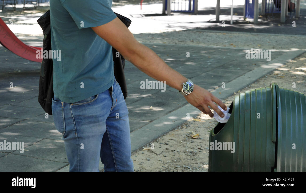 A Man Throwing Garbage Stock Photos & A Man Throwing Garbage Stock