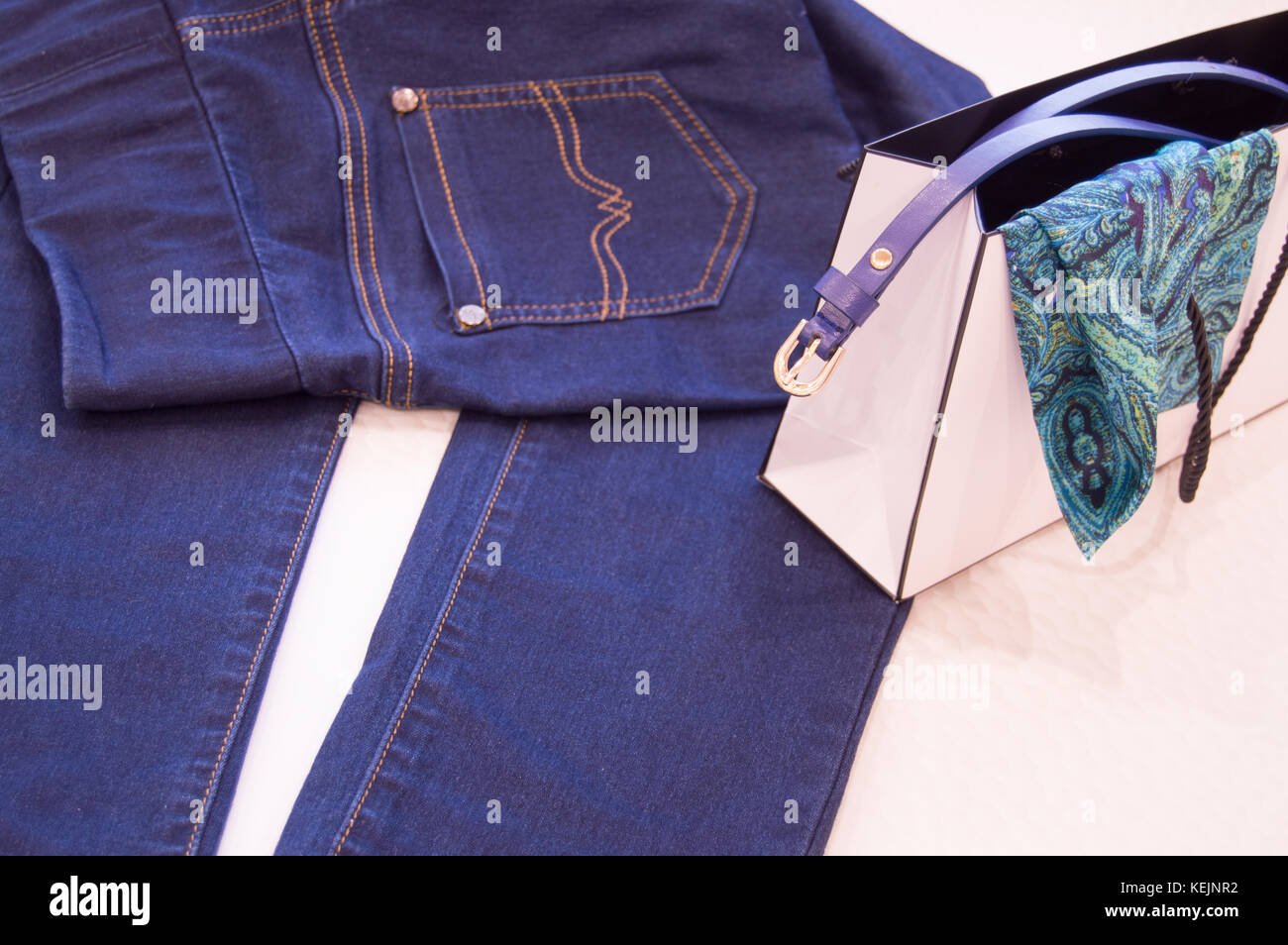 Women fashion accessories and clothing, jeans, belt, scarf. The concept