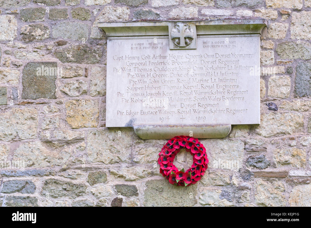 Stourton World War I Memorial with poppy wreath at Stourton, Wiltshire in October - A good life hath but a few days, but a good name endureth forever Stock Photo