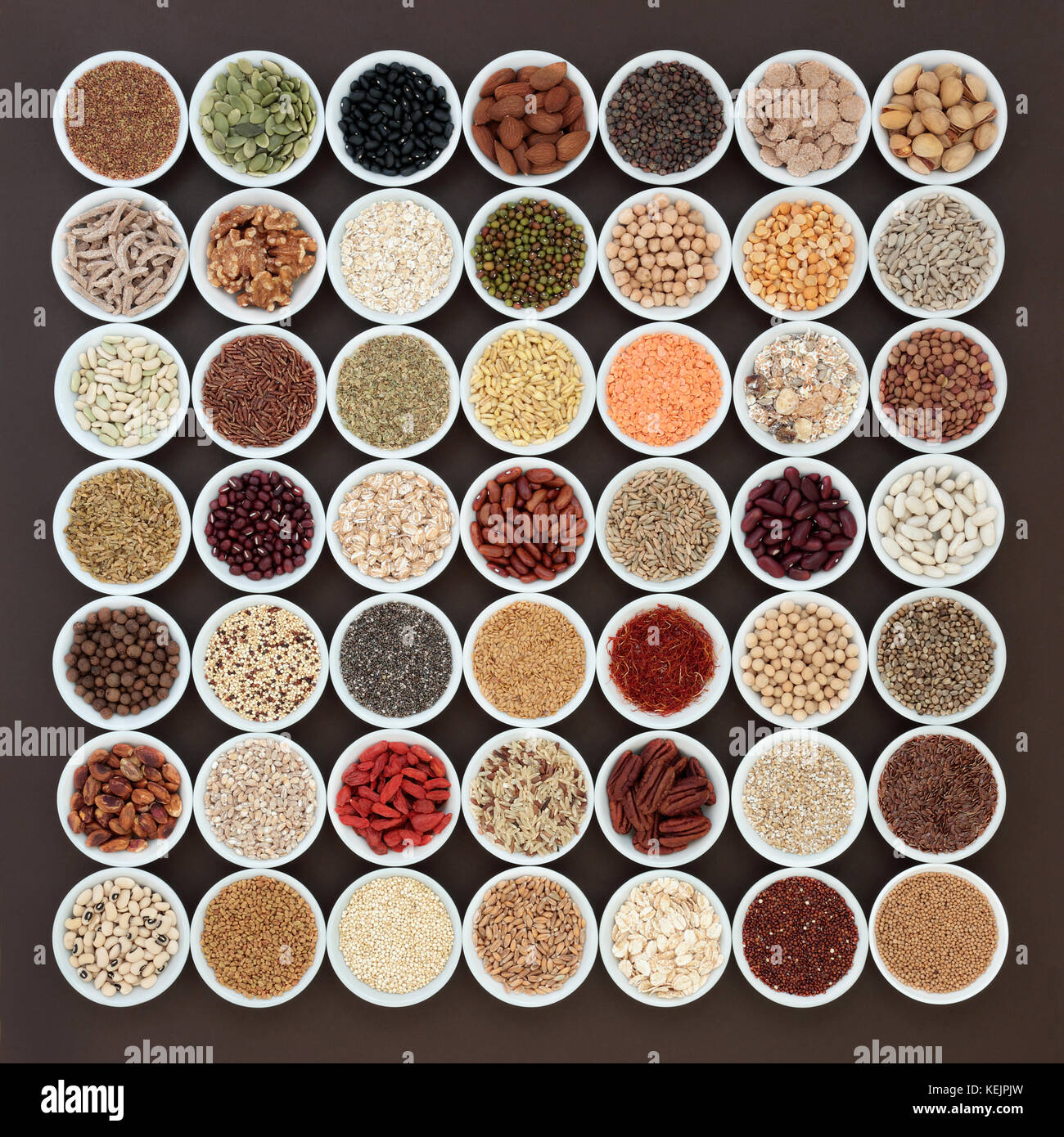 Large dried high fiber health food selection in white porcelain bowls