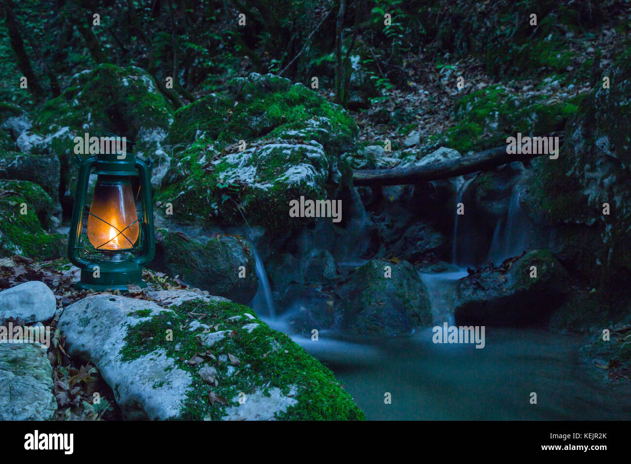 Lantern on the creek in the woods in autumn Stock Photo Alamy