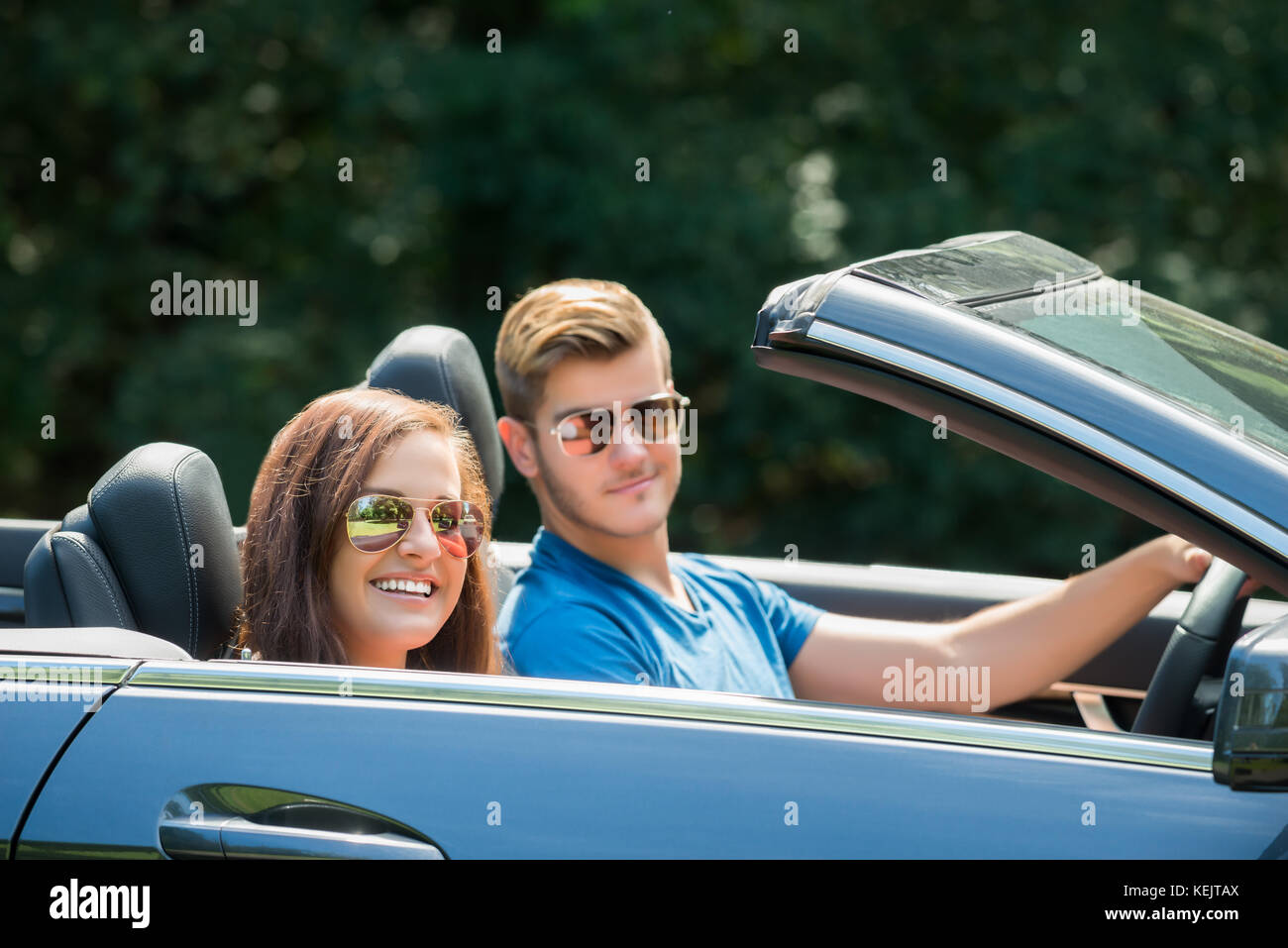 Close-up Of Young Happy Couple In A Car Stock Photo