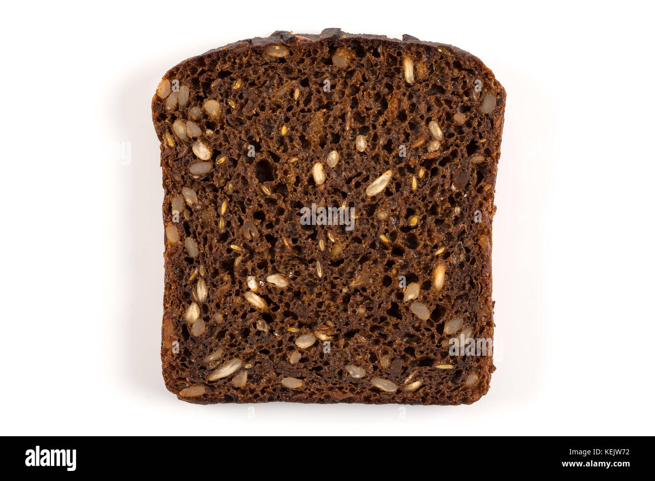 Dark rye bread with sunflower seeds on a white background Stock Photo