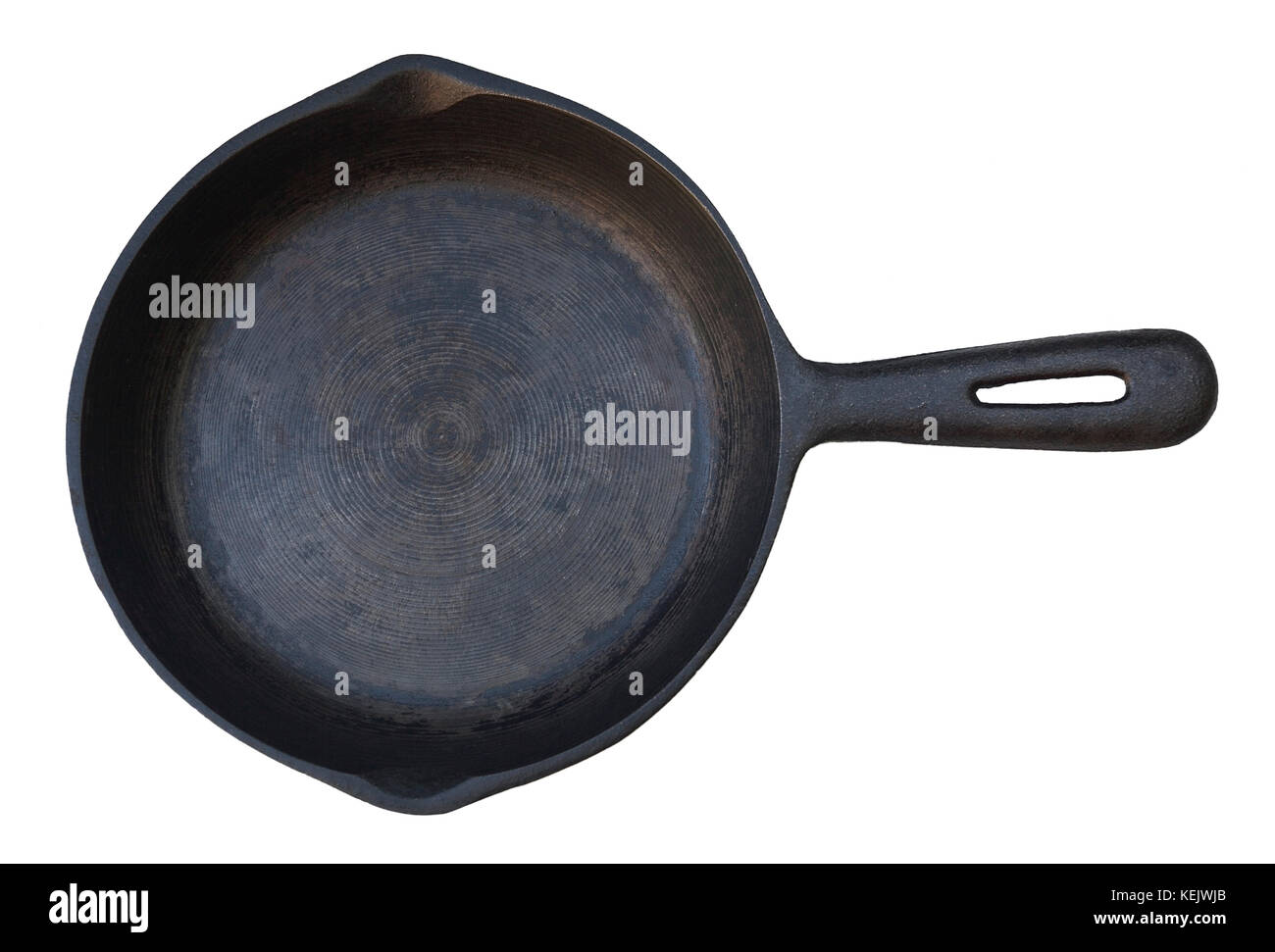 Seasoned iron frying pan. Isolated. Stock Photo