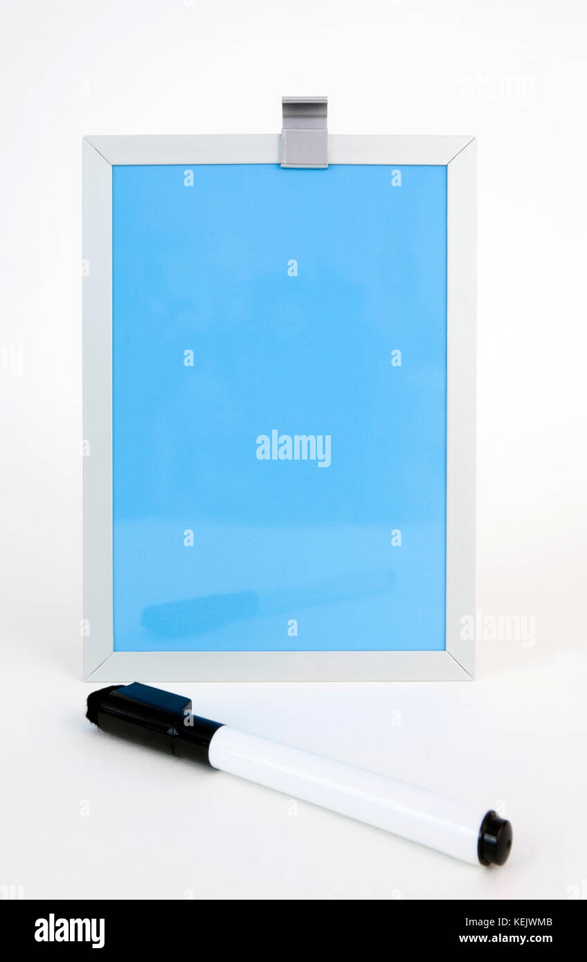 Blue dry erase board with pen in foreground. Vertical Stock Photo - Alamy