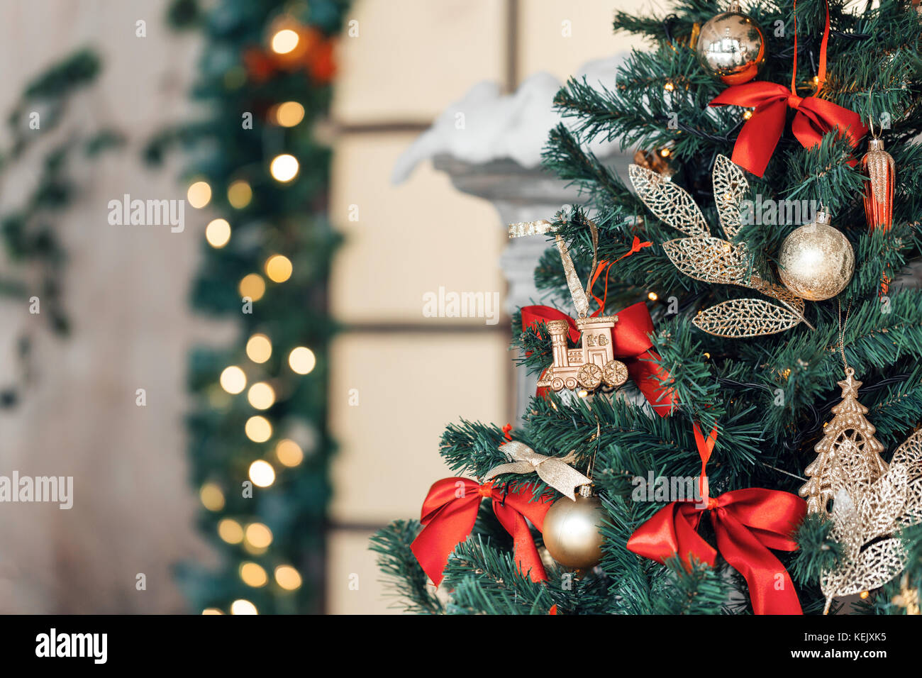 Christmas toy train and garland on the fir tree Stock Image