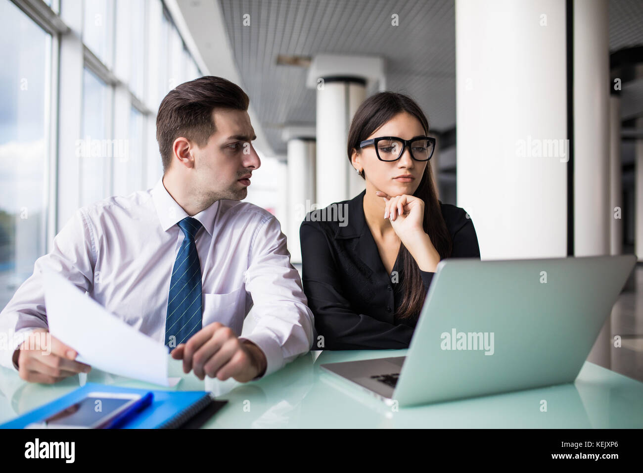 Business partners working on new project at modern office Stock Photo ...