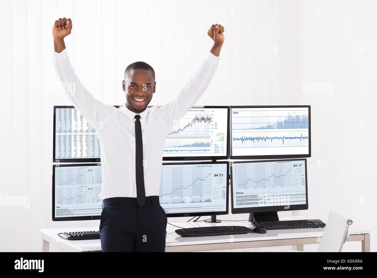 Portrait Of Happy Young Male Stock Market Broker With Raised Arm In ...
