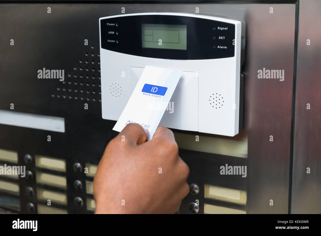 Closeup Of Businessperson's Hand Holding Keycard To Open Door Stock