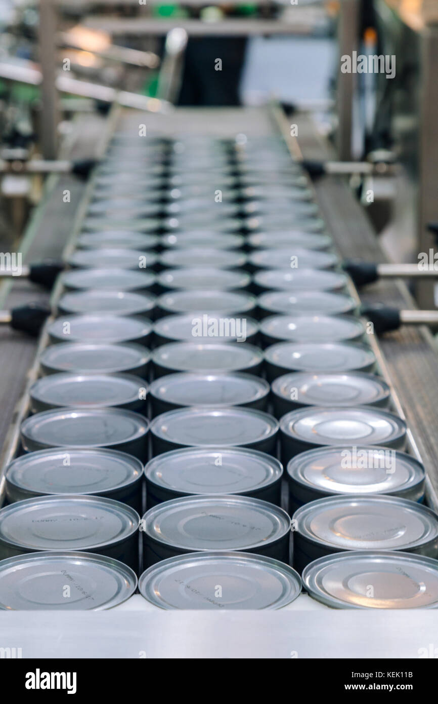 aluminum cans for food processed in factory line conveyor machine at
