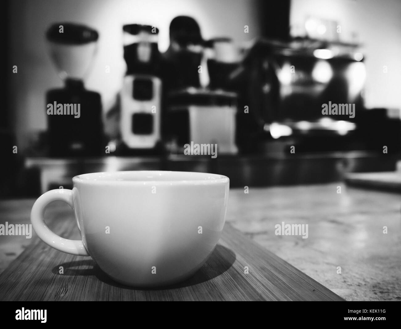 a cup of espresso coffee ready to serve in the coffee shop. black and white photo and film style. Stock Photo