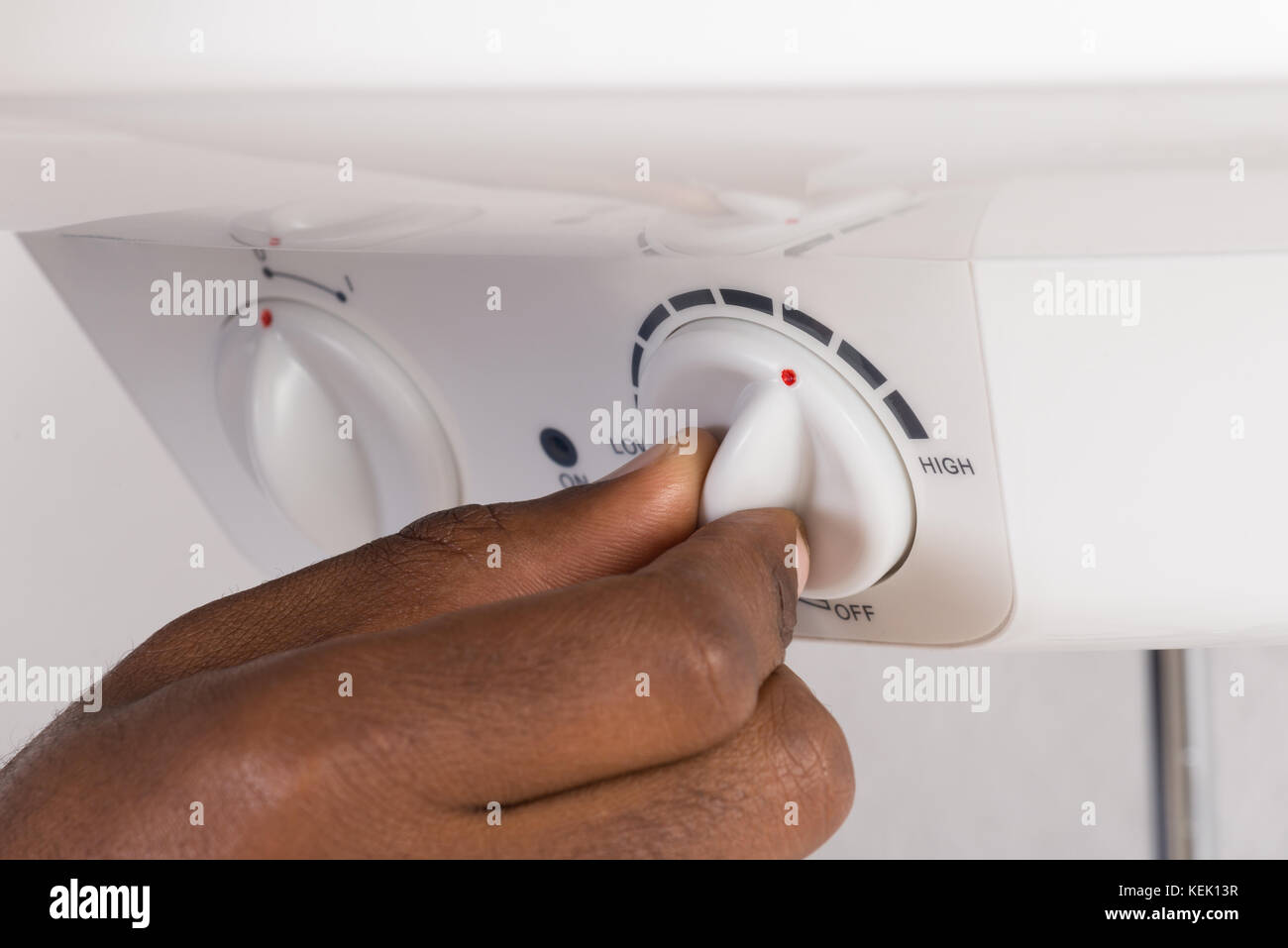 Close-up Of Plumber's Hand Turning The Knob Of Electric Boiler Stock ...