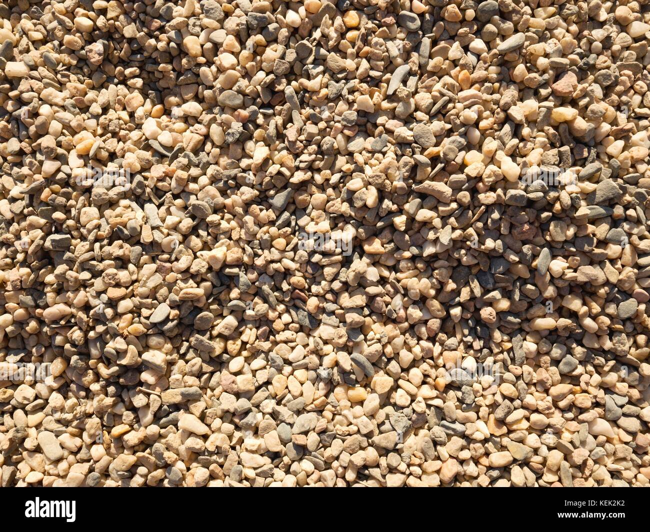 Pile of white sand and small gravel stone used as construction material.  Surround of playground Stock Photo - Alamy