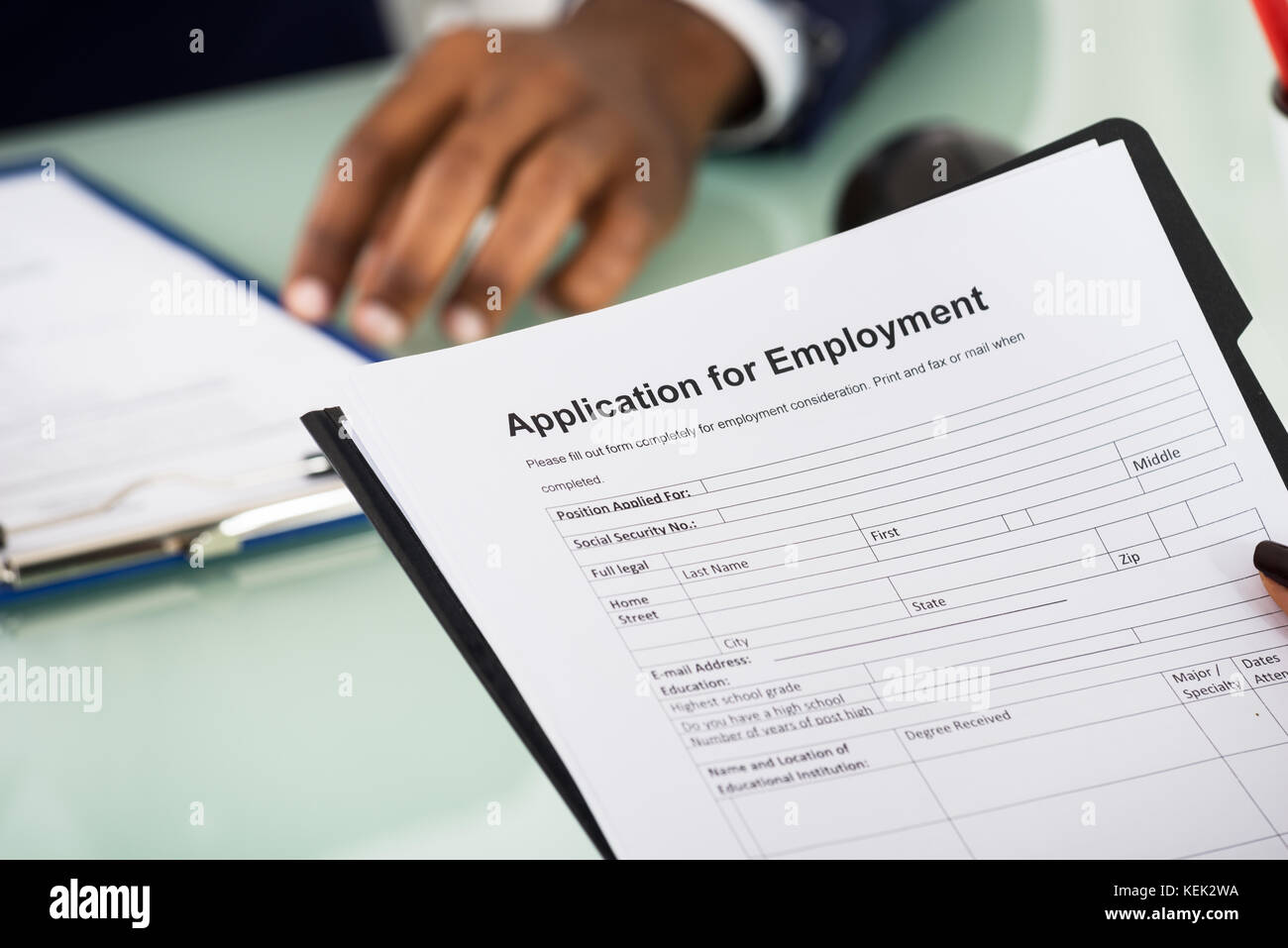 Close-up Of Female Candidate Holding Application Form Stock Photo
