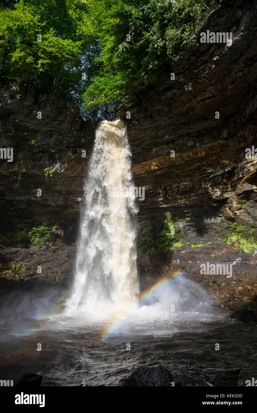 Rainbow seen in the falling water of Hardraw Force near Hawes in the Yorkshire Dales national park, England. Stock Photo