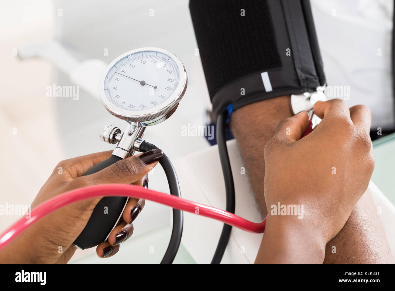 Closeup Of Doctor Measuring Patients Blood Pressure With Stethoscope Stock Photo Alamy