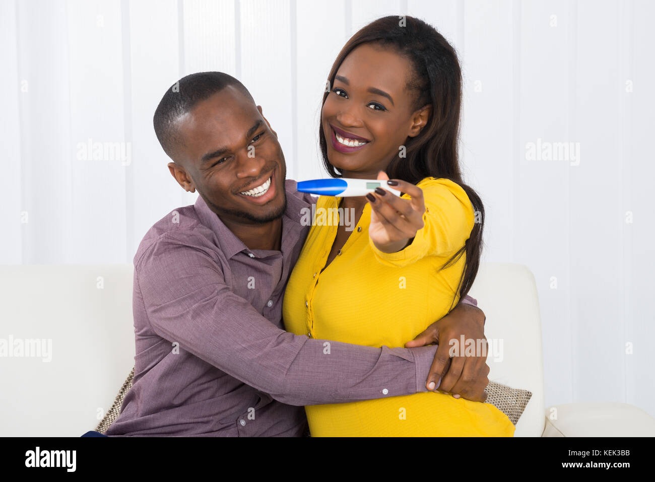 Portrait Of Young Happy African Couple Holding Pregnancy Test Stock ...