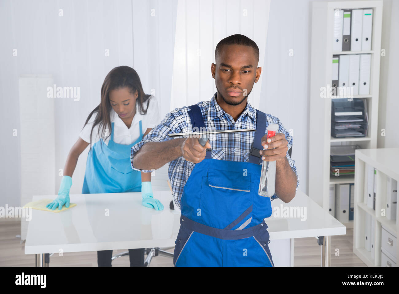 Two Professional Young African Janitors Cleaning Office Stock Photo Alamy