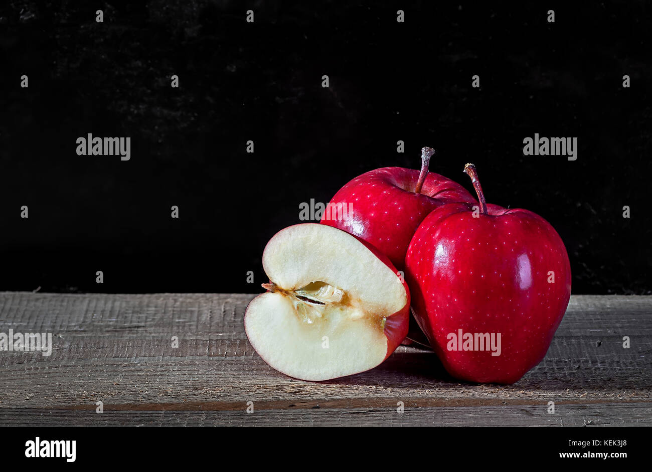 Whole and cut in half apple Stock Photo
