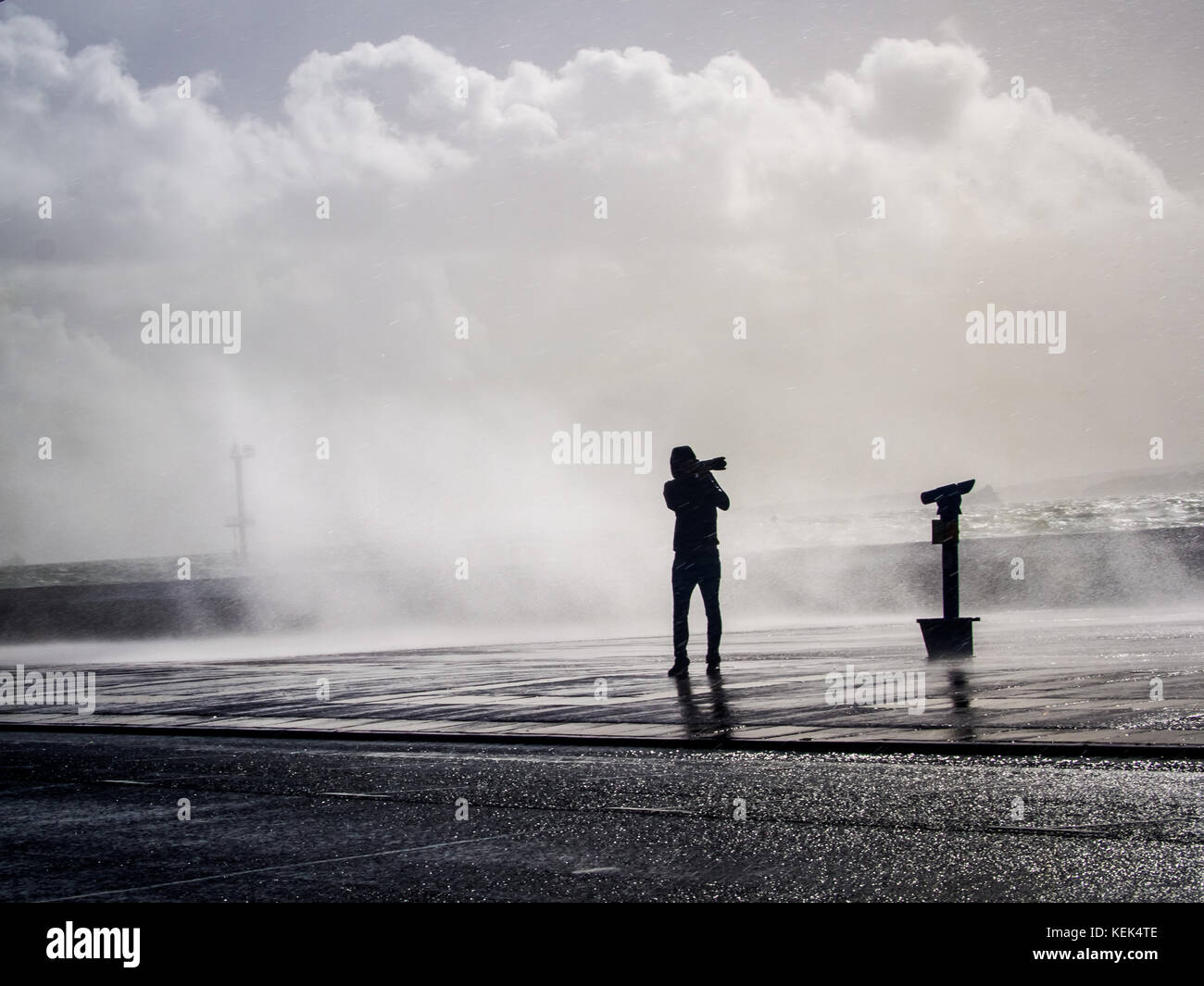 Southsea, Portsmouth, UK. 21st Oct, 2017. UK Weather. A photographer takes photos of waves breaking over Southsea sea defences as Storm Brian hits the Southern coastline of the UK. Credit: simon evans/Alamy Live News Stock Photo