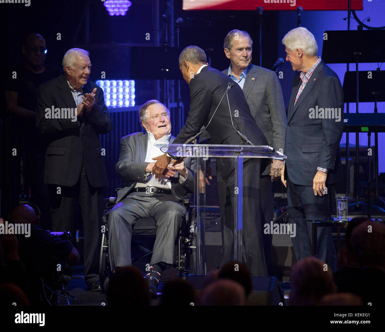 College Station, Texas USA Oct. 21, 2017: The five living former U.S. Presidents onstage at Texas A&M University's Reed Arena for a One America Response concert and fund raiser for hurricane and storm relief. Left to right, former presidents Jimmy Carter, George H.W. Bush, Barack Obama, George W. Bush, and Bill Clinton appear midway in the concert. Credit: Bob Daemmrich/Alamy Live News Stock Photo