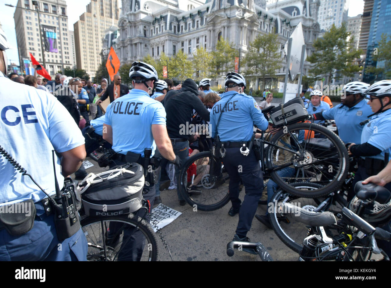 Philadelphia, PA., USA. 21st October, 2017. Protestors with REAL Justice Philadelphia confront police  on October 21, 2017 after US Attorney General Jeff Sessions delivers remarks on the Project Safe Neighborhoods during the Major Cities Chiefs Association Fall Meeting, at the nearby Pennsylvania Convention Center, in Philadelphia, PA. Upon arrival at the Frank Rizzo statue, near City Hall police officers and protesters clashed. Five people were detained, and according to a Philadelphia Police supervisorÊat the location Òwill most likely be sent home later with a citation. Stock Photo