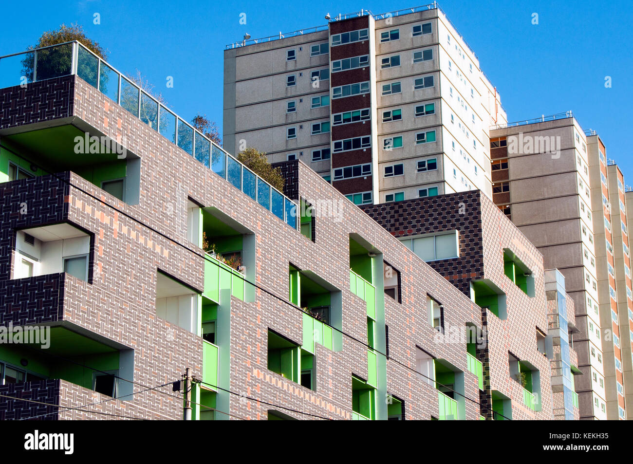 New apartment block and high rise 'housing commission' flats, Fitzroy, Victoria, Australia Stock Photo