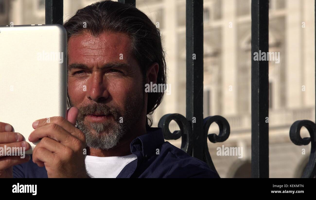 Handsome Spanish Male Using Tablet Stock Photo - Alamy