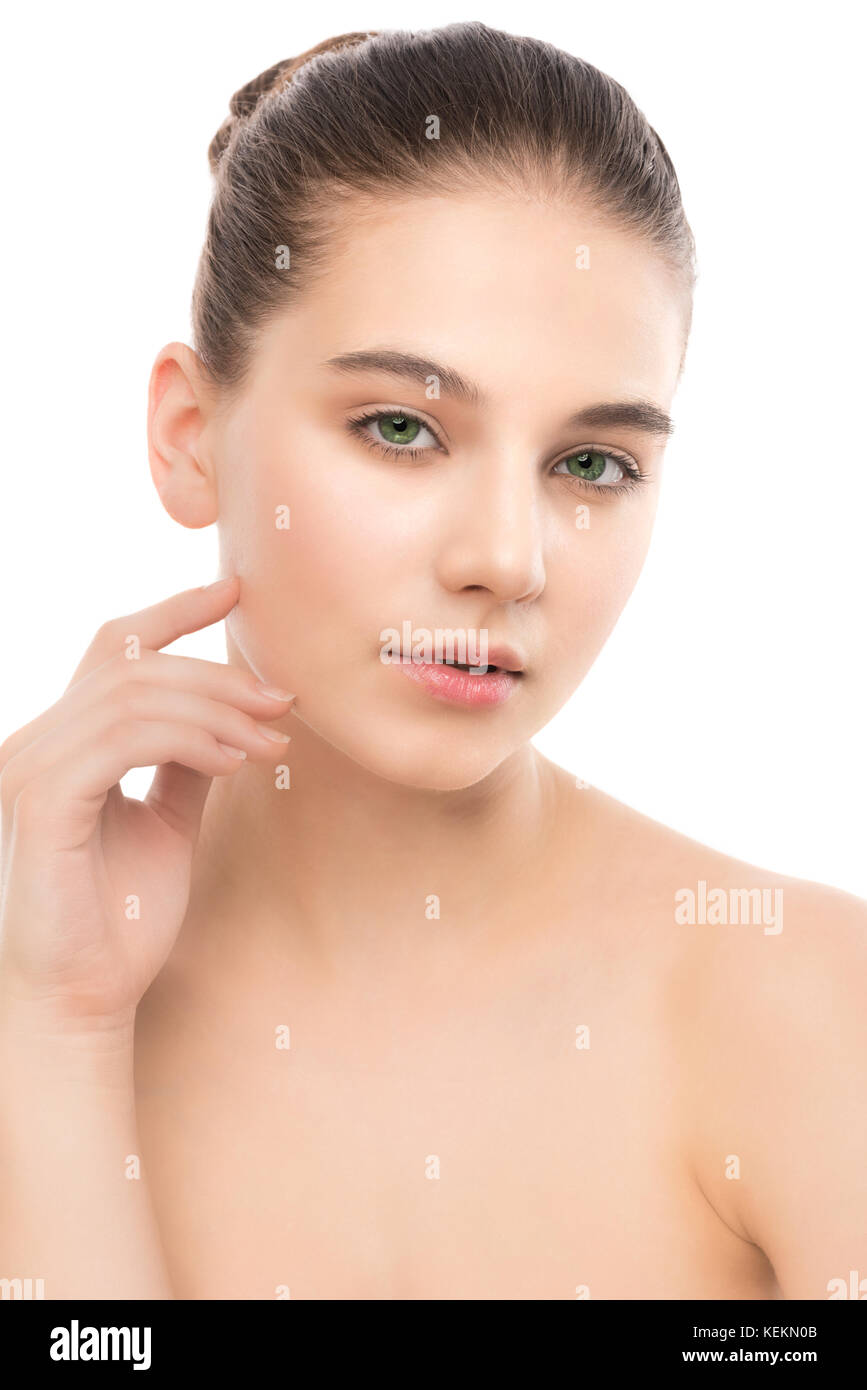 Portrait of beautiful young brunette woman with clean face. Isolated on a white. Stock Photo