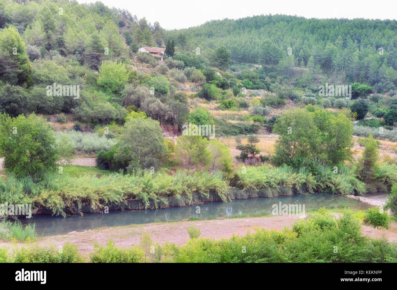 View of landscape since Rosaleda del Mijares hotel, in Montanejos village (province of Castellon - Spain). Mijares river at the bottom. Natural Stock Photo