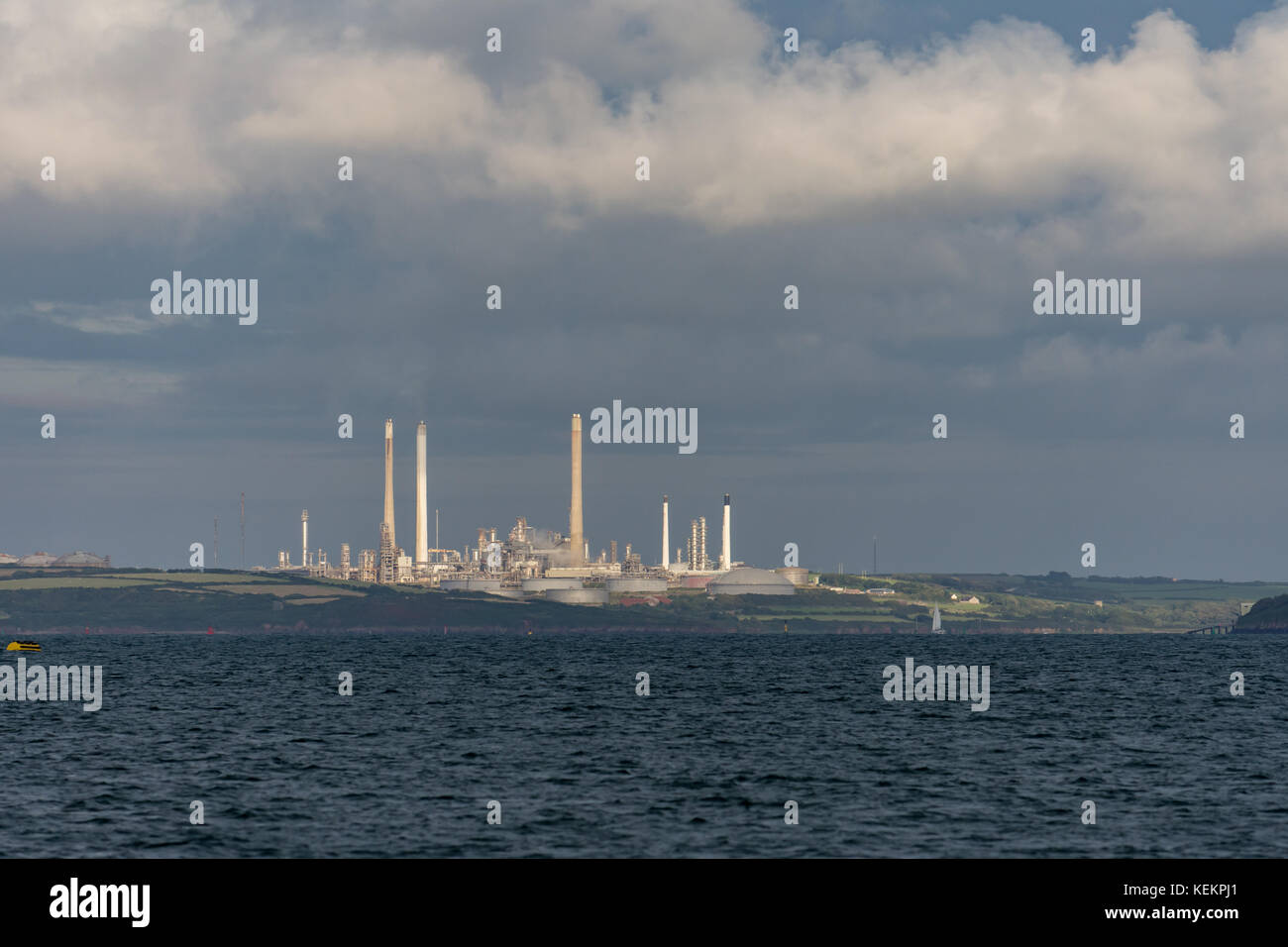 Pembrokeshire oil refinery  on a summers evening seen from a yacht anchored at Dale Stock Photo