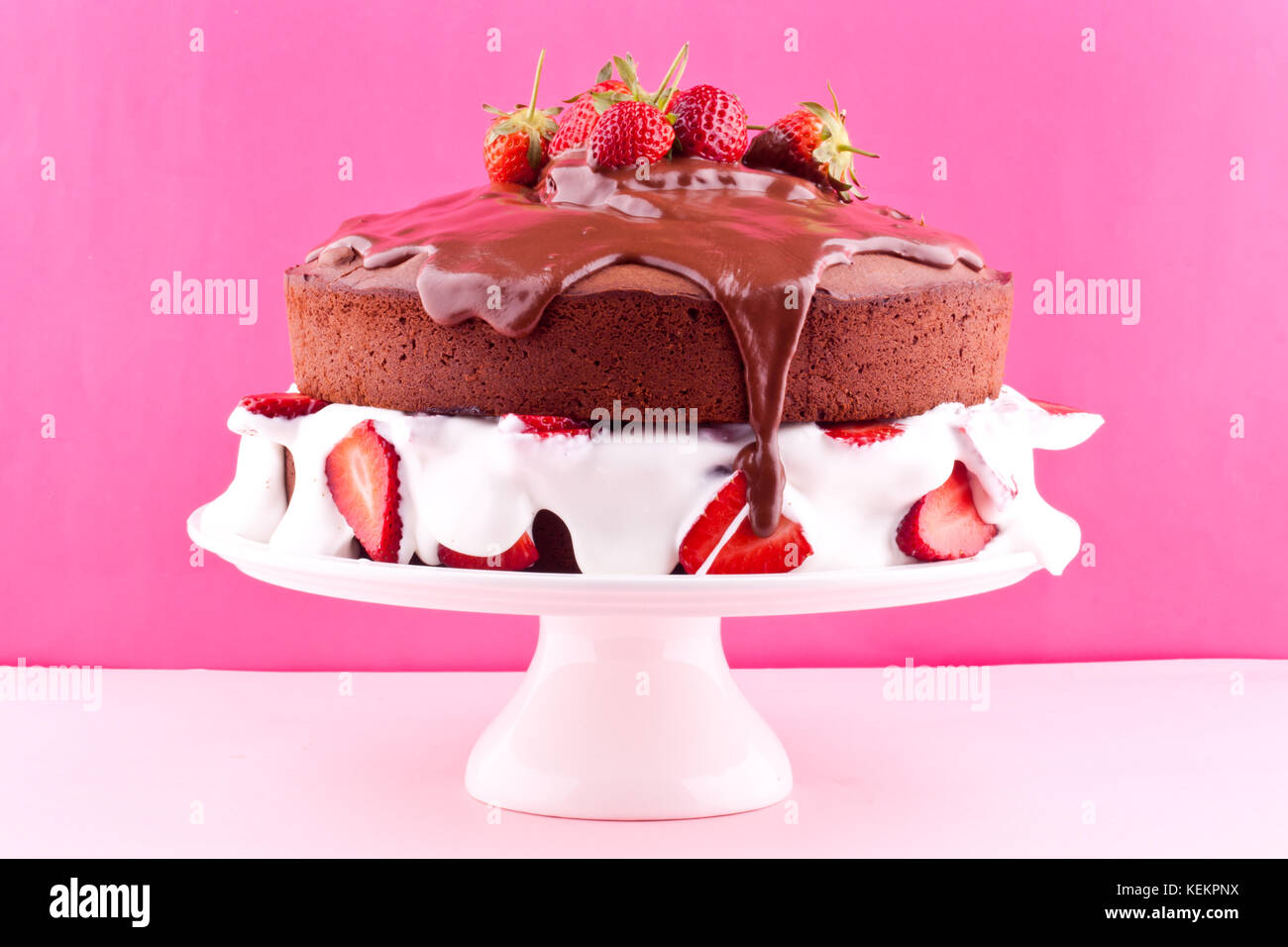 Cake stand with strawberry birthday cake hi-res stock photography and ...