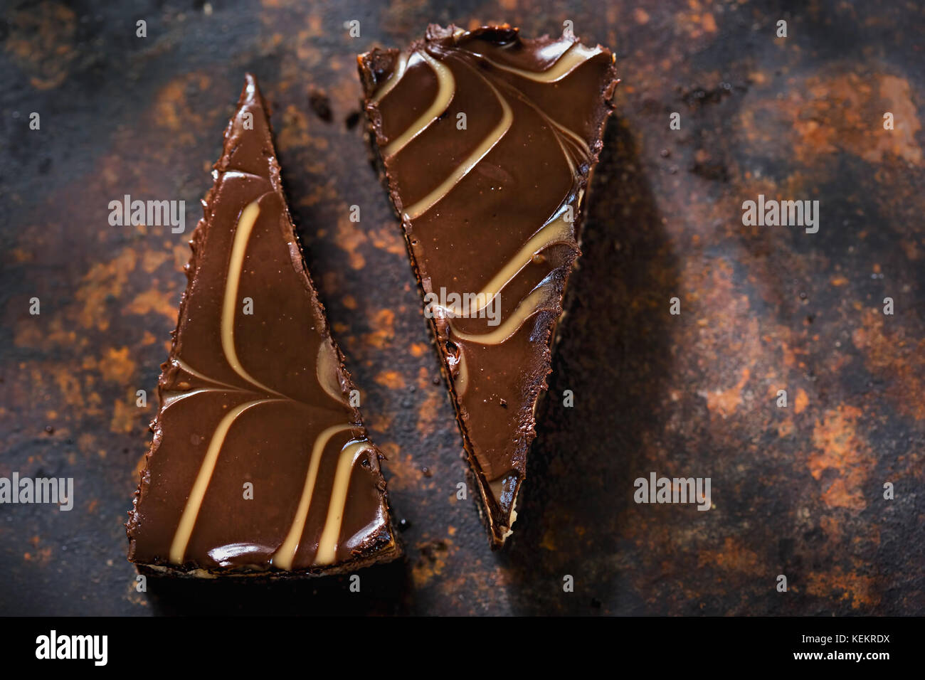 Chocolate brownie cheesecake slices. Chocolate and caramel cheesecake