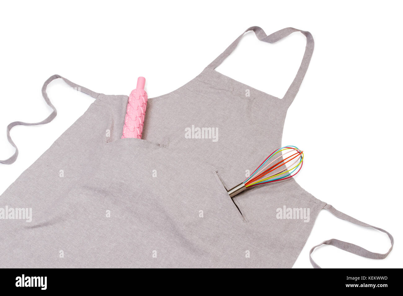 Apron with rolling pin and whisk Stock Photo
